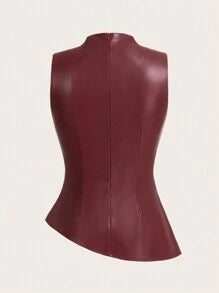 Model styling a burgundy leather-look mock neck top with ruched waist and elegant flared hem paired with dark bottoms.