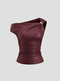 Front view of a burgundy faux leather one-shoulder top with gold ring accent, asymmetric neckline, and ruched fitted waist.