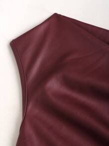 Detailed view of the ruched burgundy faux leather waist showing soft gathers, smooth finish, and clean lower-hem stitching.
