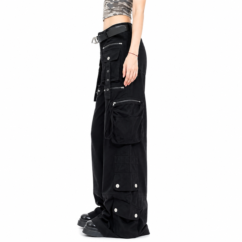 Black wide-leg cargo pants with multiple utility pockets, silver snap details, and a matching black belt, shown on a model from the waist down against a white background.