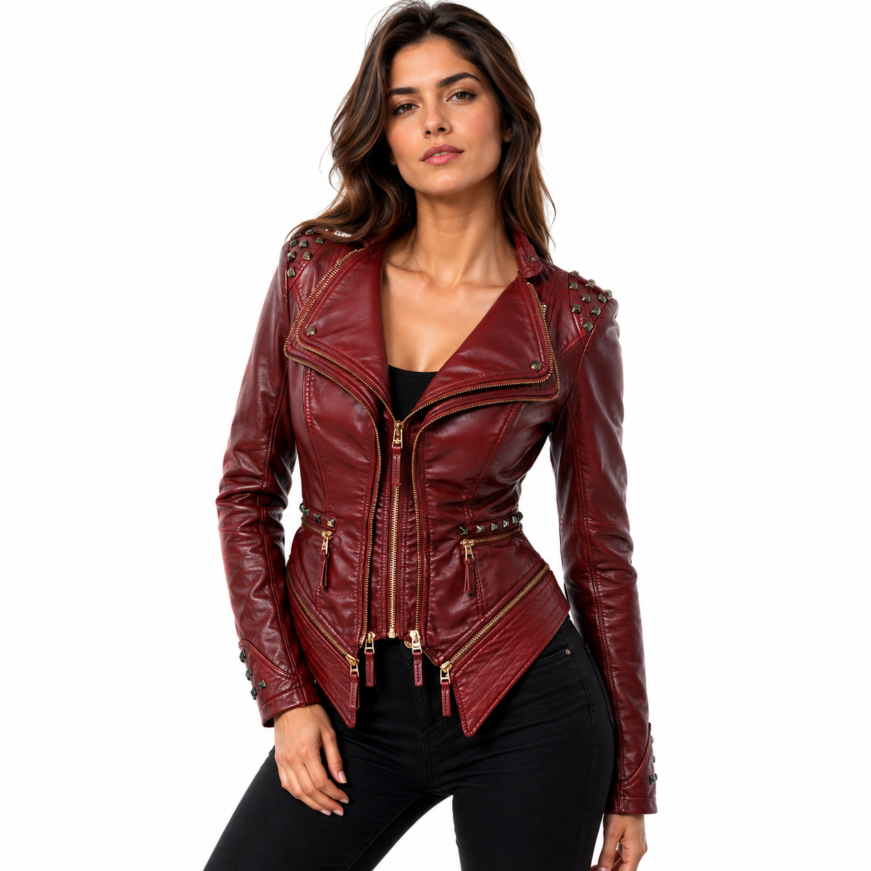 A woman modeling a burgundy faux leather moto jacket with gold-tone hardware and studded details on the shoulders, paired with black pants against a plain white background.