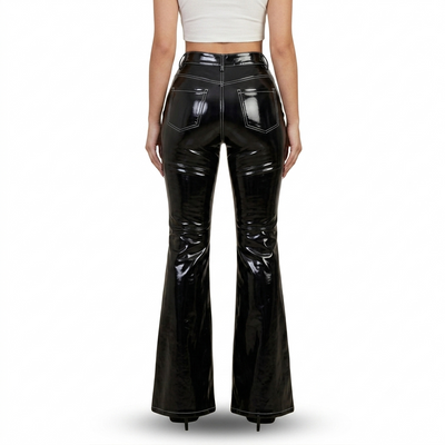 A model shown from the back wearing high-waisted, glossy black patent leather flare pants, paired with a white crop top, against a plain white background.