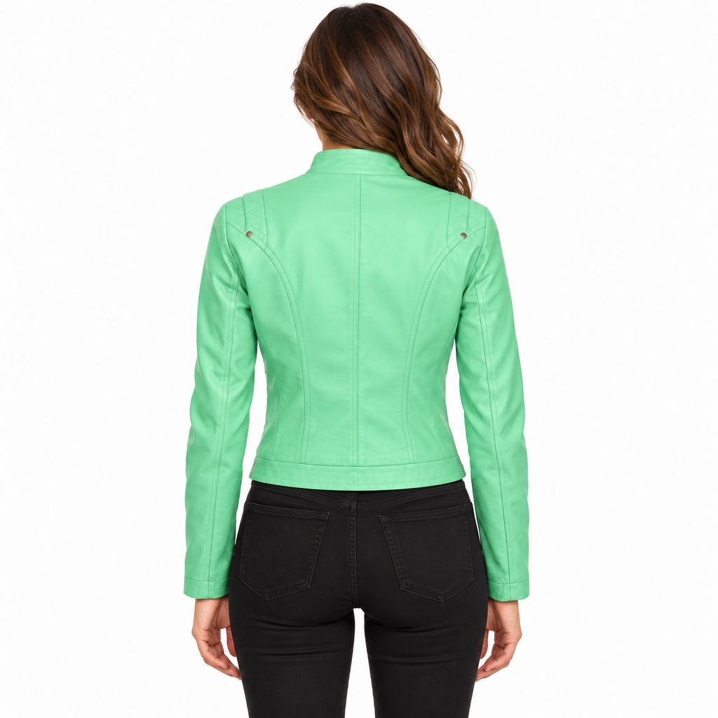 A woman viewed from the back wearing a bright mint green faux leather moto jacket and black jeans, set against a plain white background.