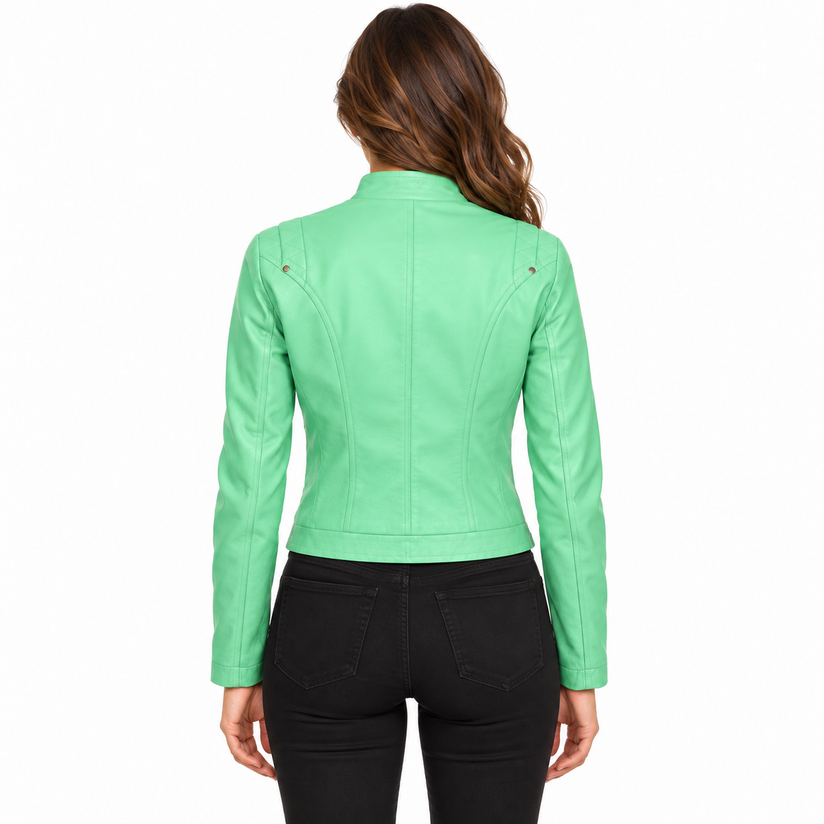 A woman viewed from the back wearing a bright mint green faux leather moto jacket and black jeans, set against a plain white background.